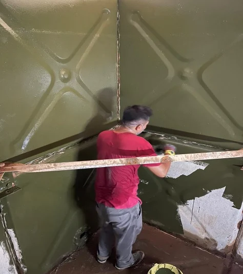 Technician servicing a fire protection water tank